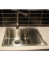 Stainless steel sink in the kitchen interior