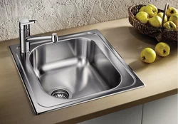 Stainless steel sink in the kitchen interior