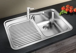 Stainless steel sink in the kitchen interior