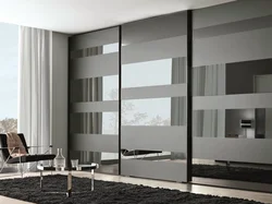 Black wardrobe in the living room interior