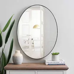 Овальное зеркало в интерьере ванной