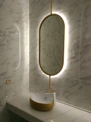 Oval Mirror In The Bathroom Interior