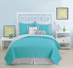 Turquoise bedspread in the bedroom interior