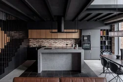 Black kitchen in loft interior