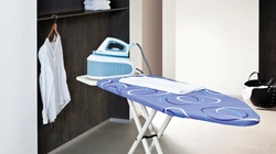 Ironing board in the bedroom interior