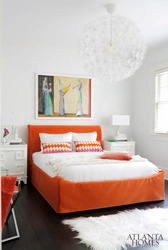 Orange bed in the bedroom interior
