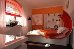 Orange Bed In The Bedroom Interior