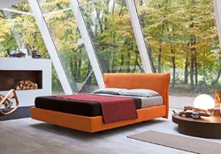 Orange bed in the bedroom interior