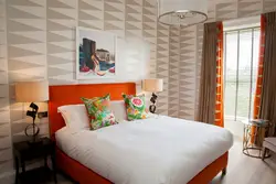 Orange bed in the bedroom interior