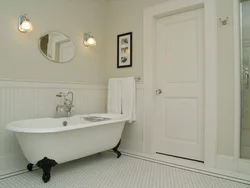 White door in the bathroom interior