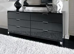 Gray chest of drawers in the bedroom interior