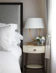 White nightstands in the bedroom interior