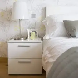 White nightstands in the bedroom interior
