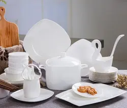 White dishes in the kitchen interior