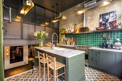 Green loft kitchen in the interior