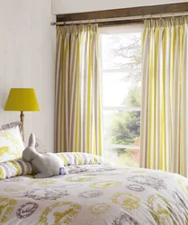 Mustard curtains in the bedroom interior