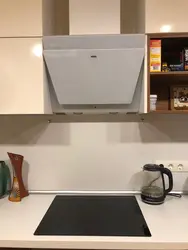 Beige hood in the kitchen interior