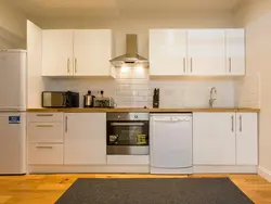 Beige hood in the kitchen interior