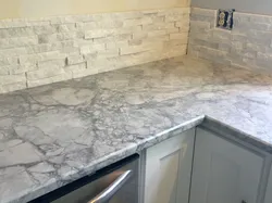 Giallo marble countertop in the kitchen interior