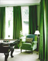 Green velvet curtains in the living room interior