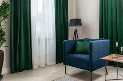 Green velvet curtains in the living room interior