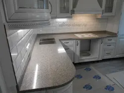 Gray marble countertop in the kitchen interior