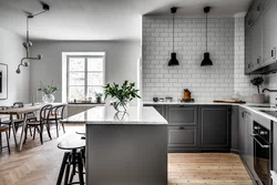 Dark walls, light kitchen in the interior