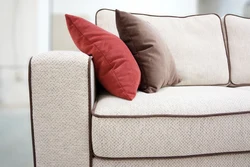 Sofa without armrests in the living room interior
