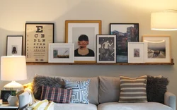 Paintings on a shelf in the living room interior