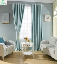 Gray-blue curtains in the bedroom interior