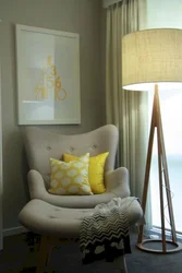 Armchair with floor lamp in the bedroom interior