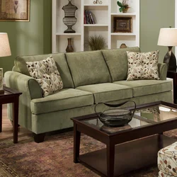 Green Sofa In A Beige Living Room Interior