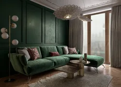 Green sofa in a beige living room interior