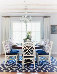 Blue chairs in the interior of a white kitchen