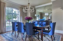 Blue chairs in the interior of a white kitchen