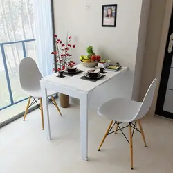 Square table in the kitchen in the interior