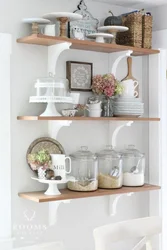 White shelves in the kitchen interior