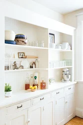 White shelves in the kitchen interior