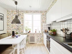 Wallpaper with houses in the kitchen interior