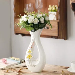 Vase with flowers in the kitchen interior