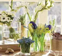 Vase with flowers in the kitchen interior