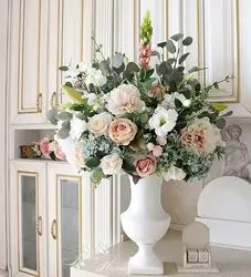 Vase with flowers in the kitchen interior