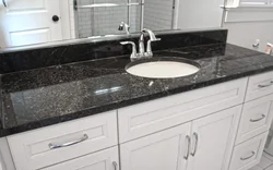 Black marble countertop in the kitchen interior