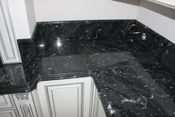 Black marble countertop in the kitchen interior