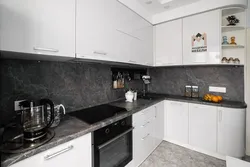 Black marble countertop in the kitchen interior