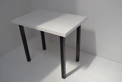 Table With Black Legs In The Kitchen Interior