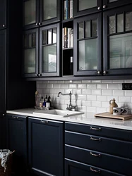 Gray Kitchen With Black Handles In The Interior