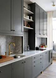 Gray kitchen with black handles in the interior