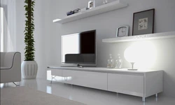 Белая тумба под телевизор в интерьере гостиной