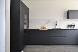 Gray kitchen in the interior with marble countertops